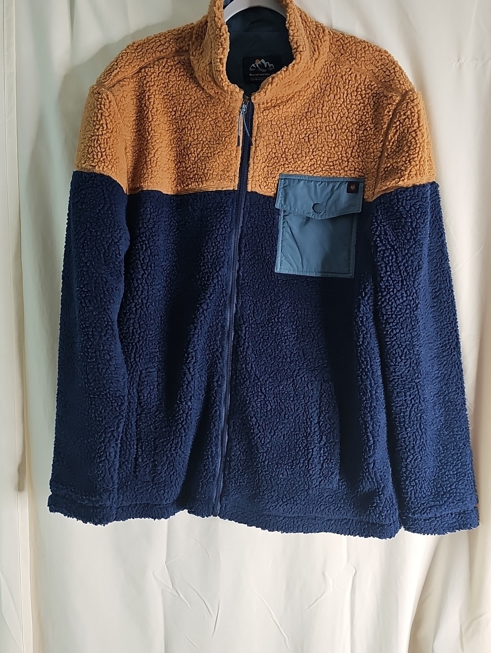 Mountain and Isles Light Blue Jacket with Navy Trim